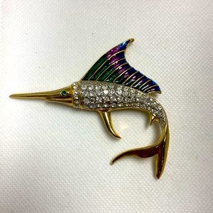 Costume gold plate marlin brooch. Clear rhinestone body & enamel fin. Green eye.